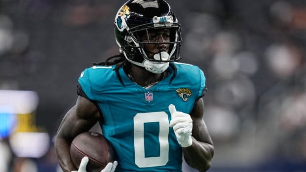 Jacksonville Jaguars wide receiver Calvin Ridley (0) runs drills before an NFL preseason football game against the Dallas Cowboys, Saturday, Aug. 12, 2023, in Arlington, Texas. (AP Photo/Tony Gutierrez)   